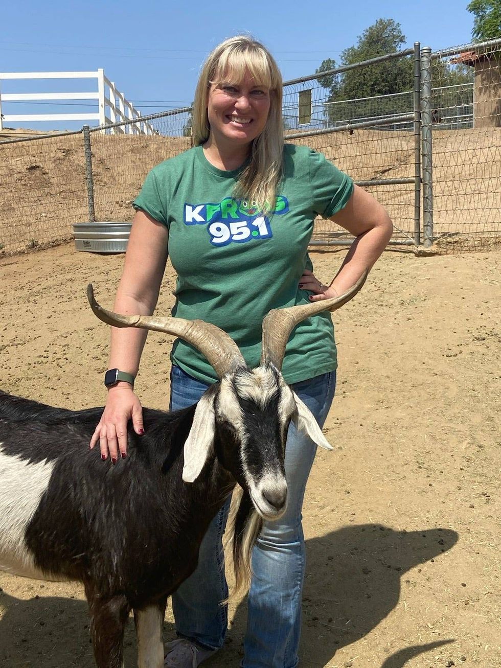 Pepper with a goat at All Things Hooved Animal Rescue in Woodcrest