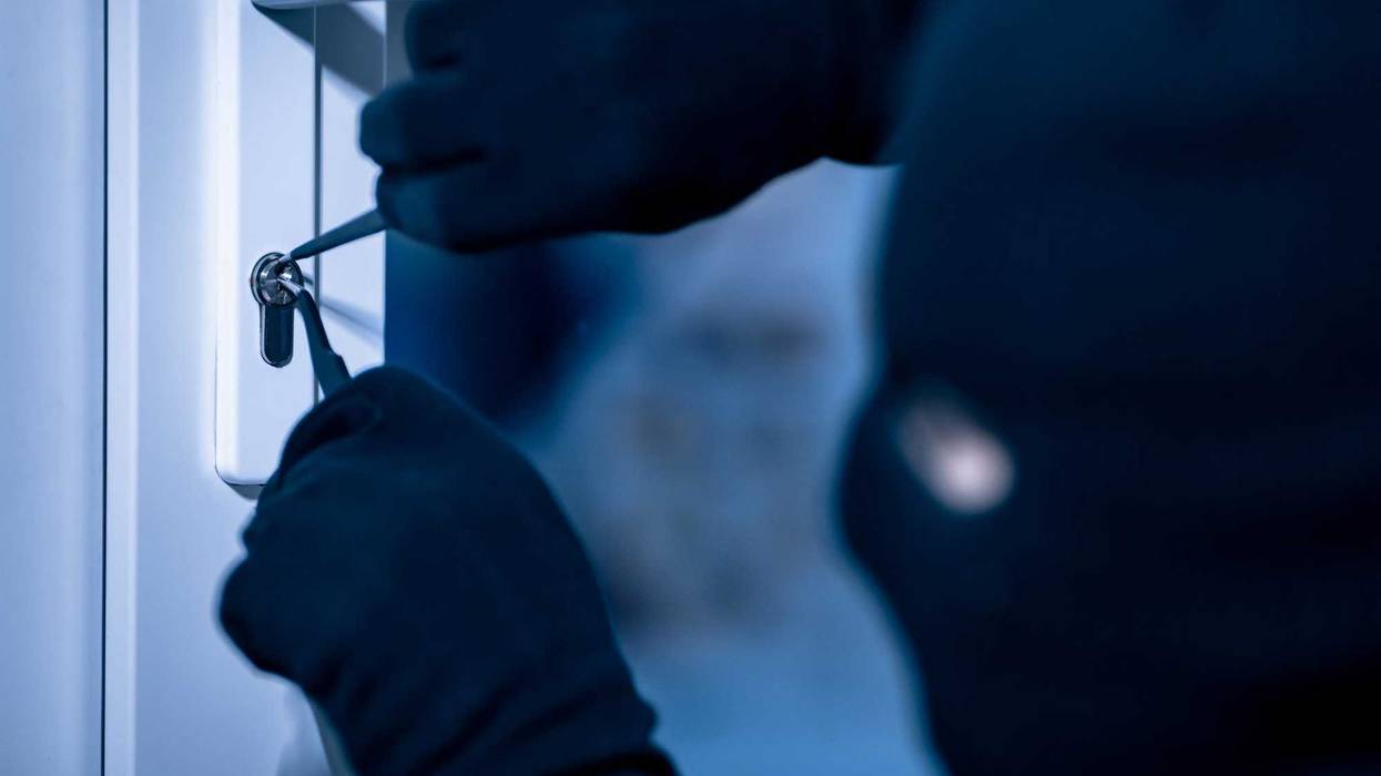 Person breaking into a home.
