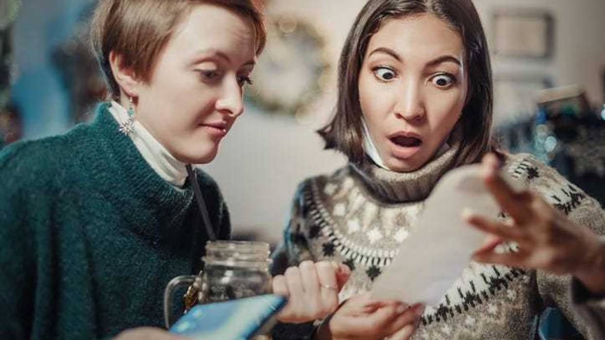 Person checking their receipt shocked at the price.