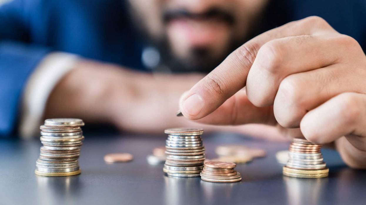 Person counting their money.