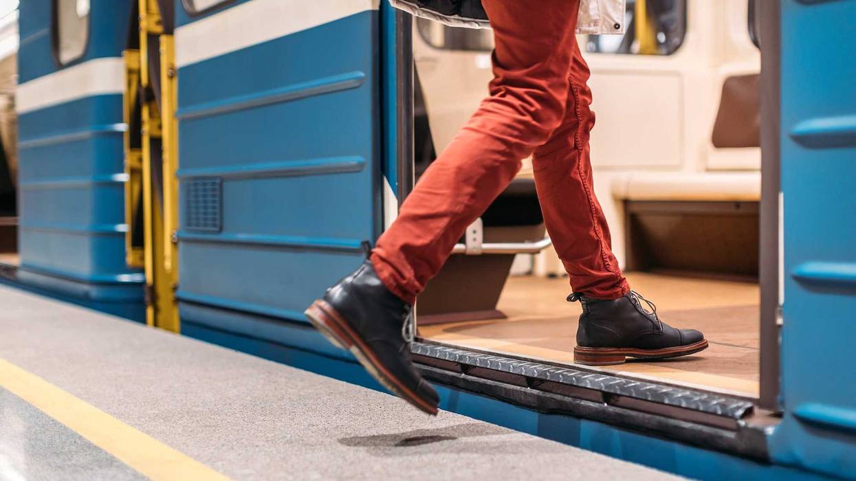 Person getting on a train.