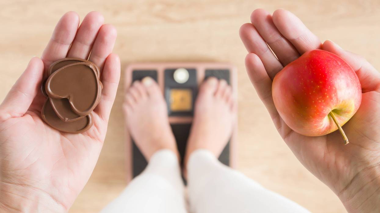 person holding food on scale