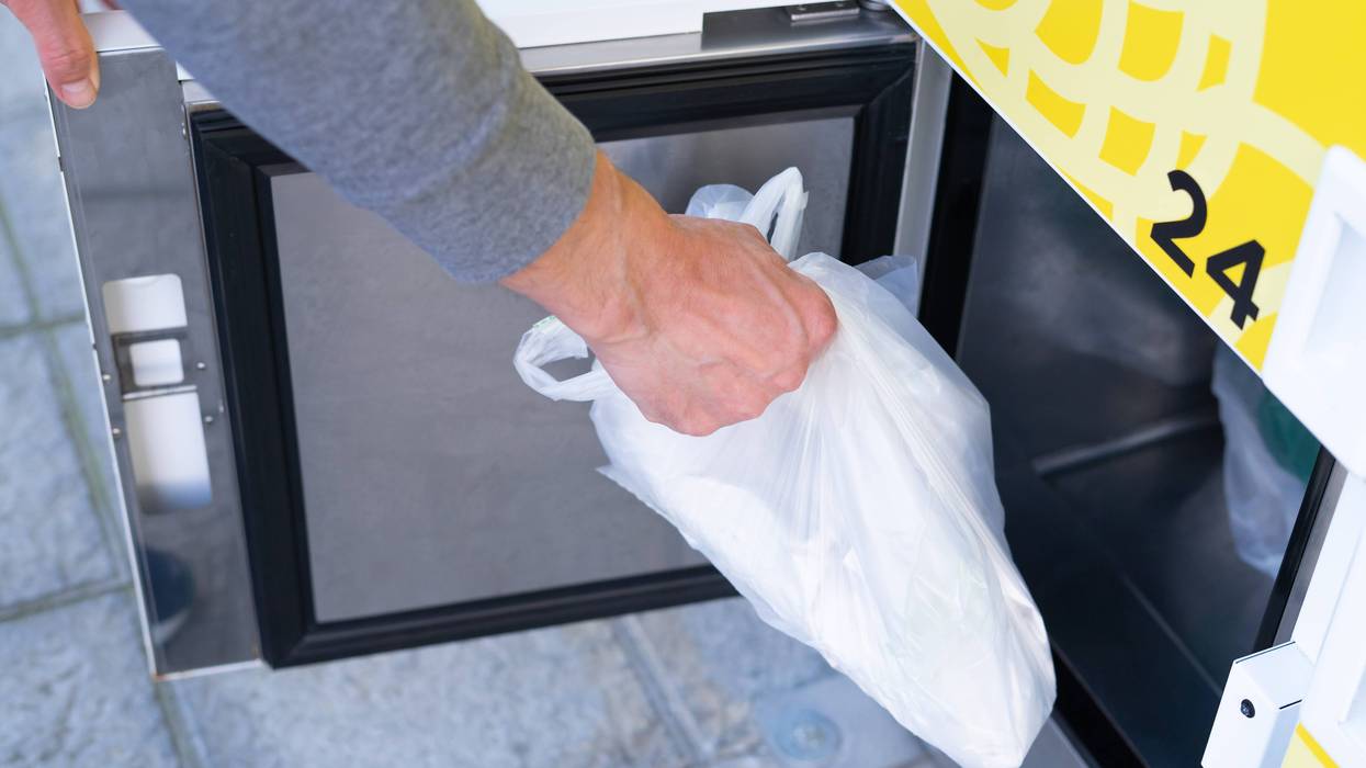 Person picking up groceries from a food locker