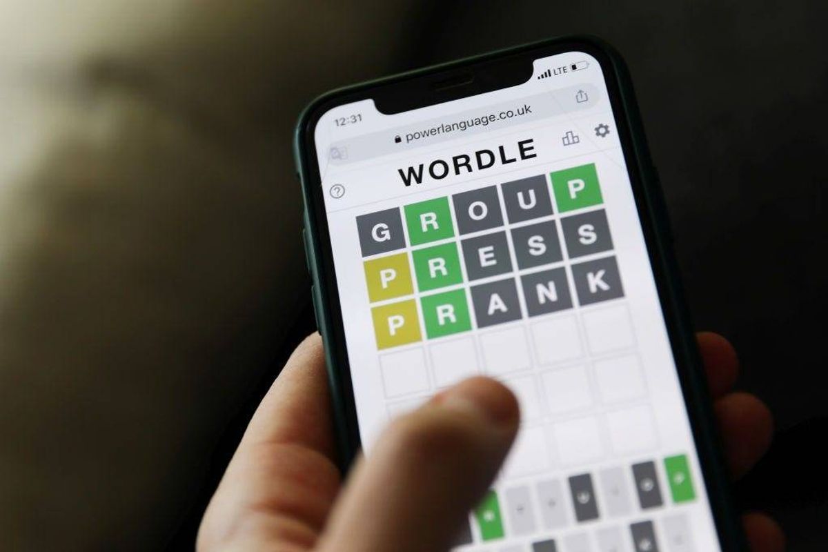 Person plays the popular Wordle game on their cellphone.