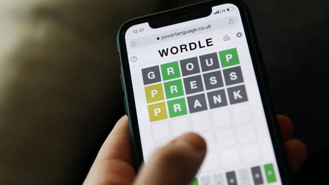 Person plays the popular Wordle game on their cellphone.