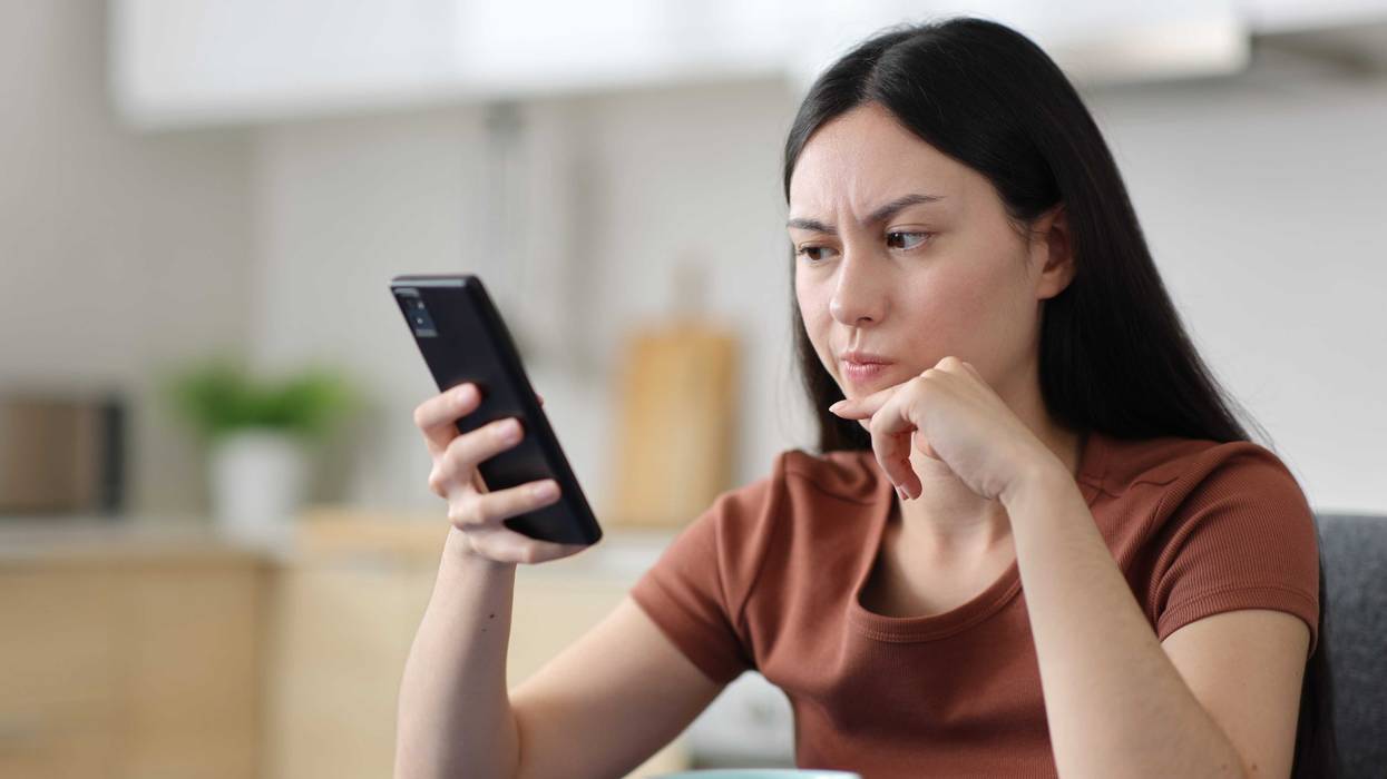 Person reading suspicious message