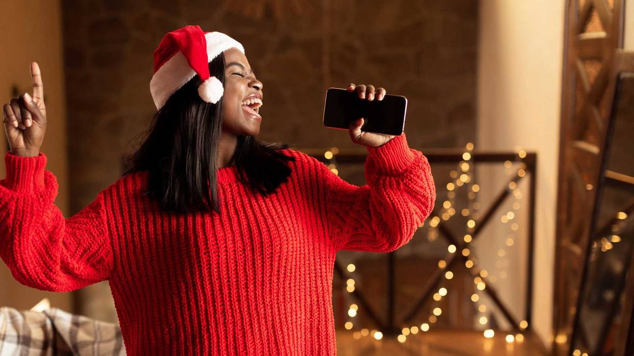 Person singing Christmas songs.
