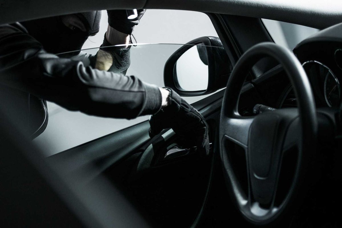 Person stealing a car.