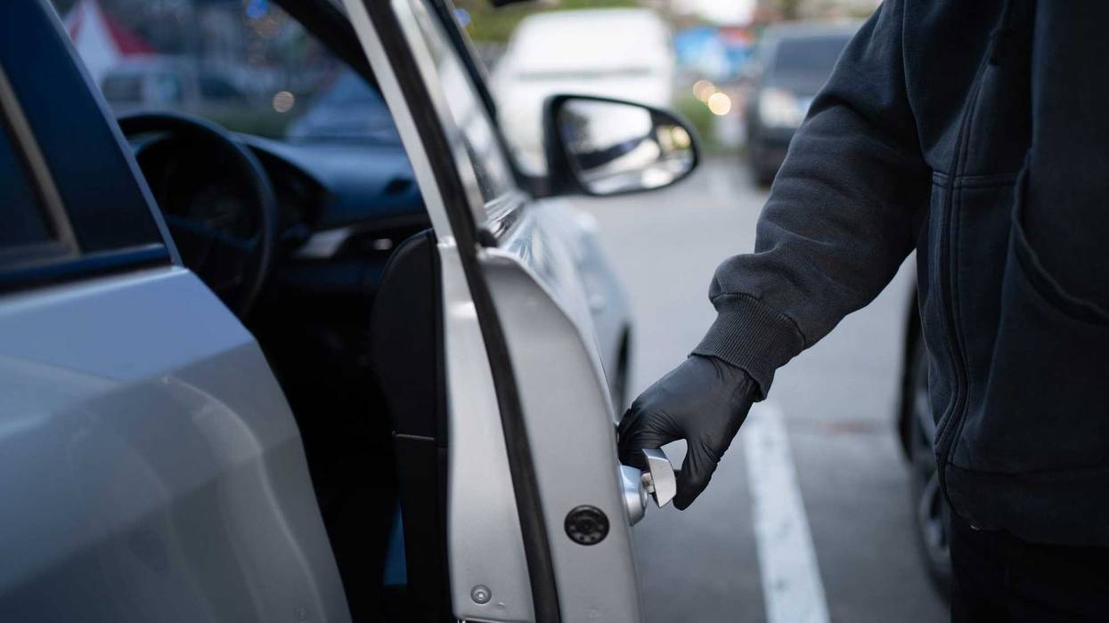 Person stealing a car.