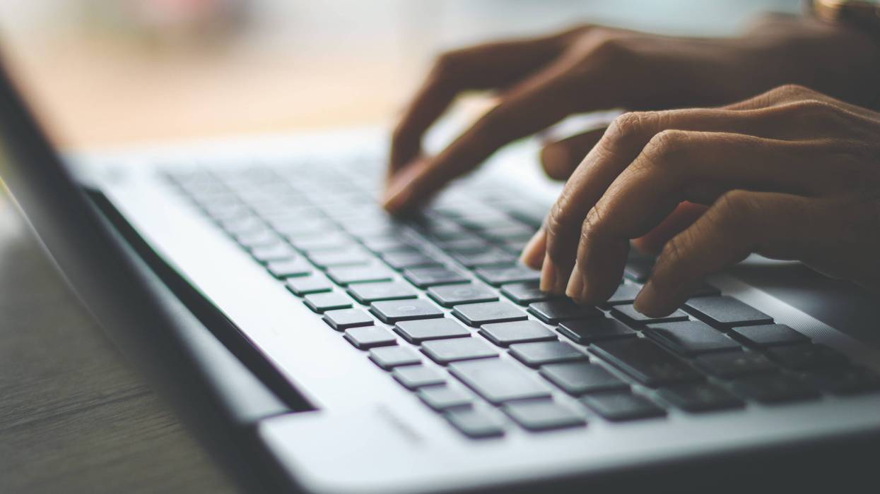 Person typing on computer
