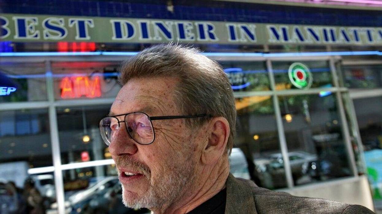 Pete Hamill responds during an interview at the Skylight Diner in New York. The longtime New York City newspaper columnist and author has died. (AP)
