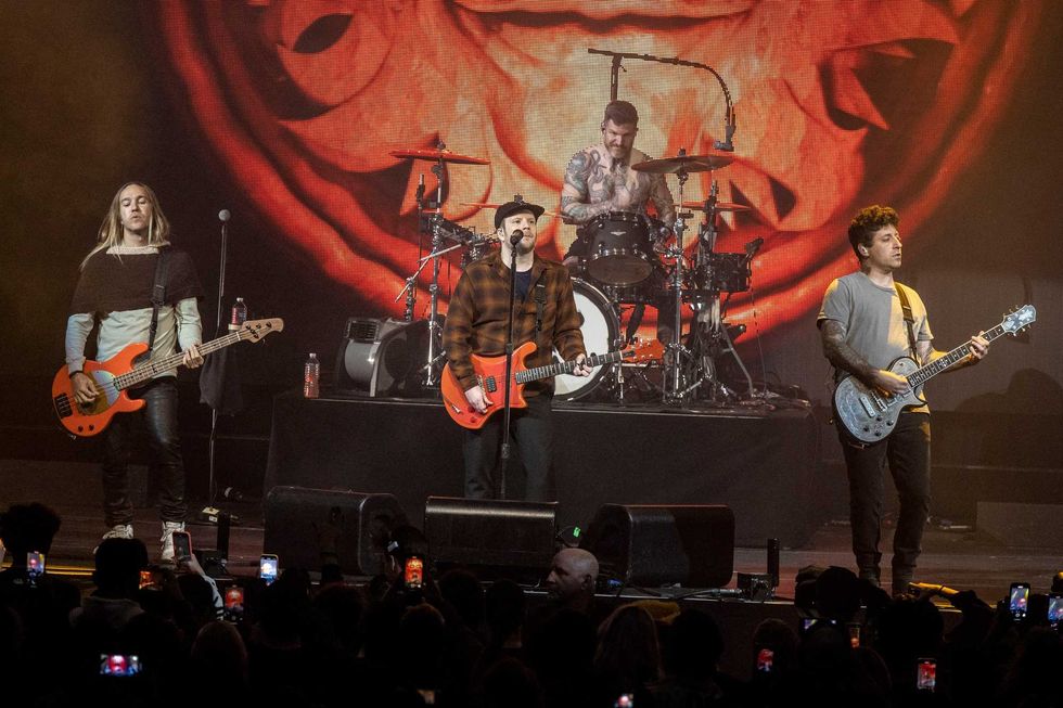 Pete Wentz, Patrick Stump, Andy Hurley and Joe Trohman perform