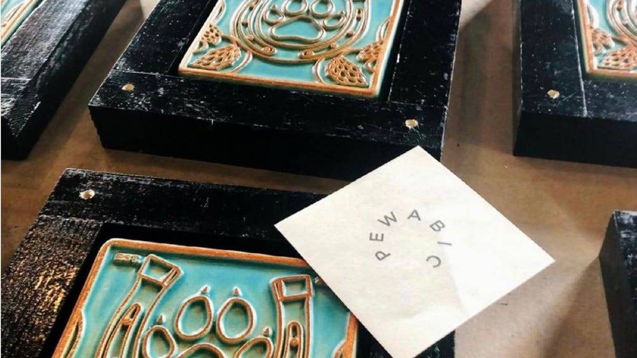Pewabic tiles at inlaid in the wall at Dog and Pony Show Brewing Co.