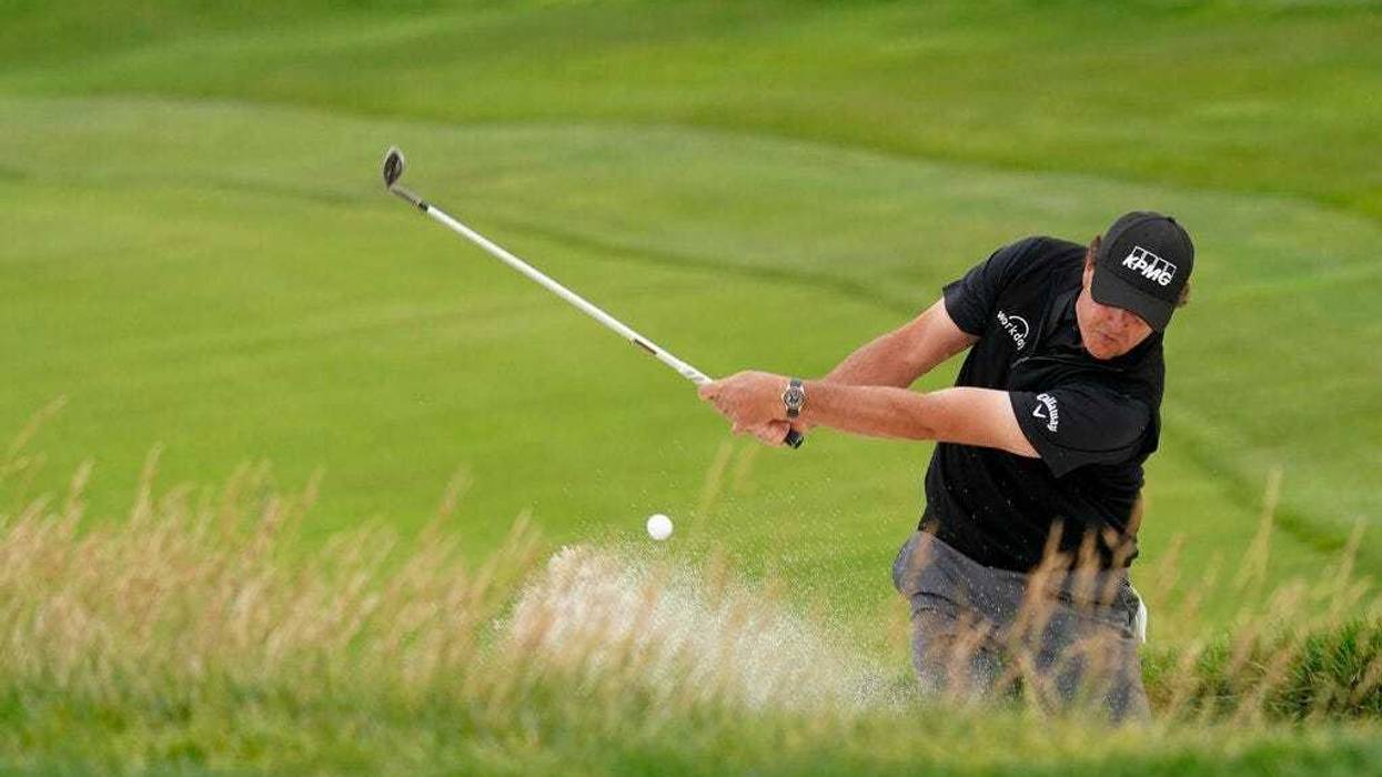 Phil Mickelson hits out of the bunker on the 10th hole during the first round of the U.S. Open Championship golf tournament Thursday, June 13, 2019, in Pebble Beach, Calif.