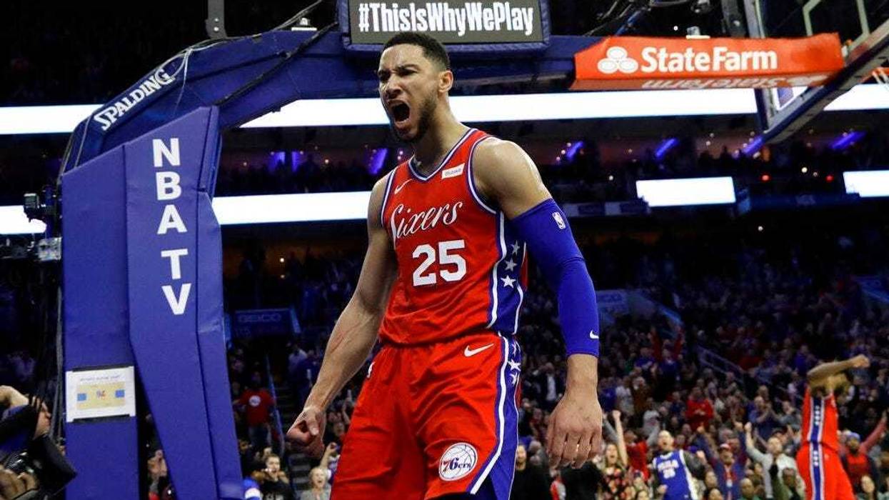 Philadelphia 76ers' Ben Simmons reacts after being fouled during the second half of the team's NBA basketball game against the Denver Nuggets