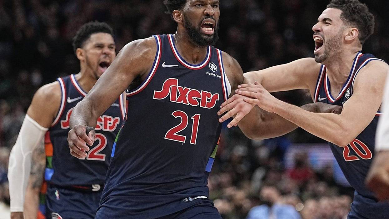 Philadelphia 76ers forward Georges Niang (20) congratulates center Joel Embiid (21)