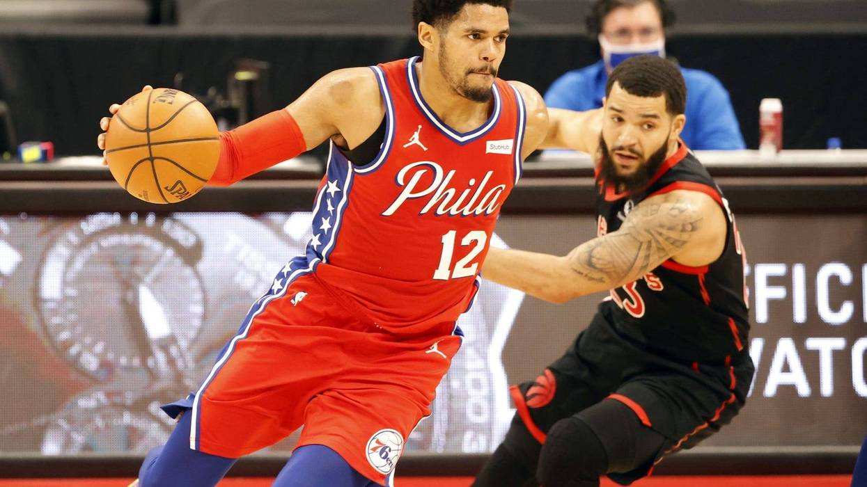 Philadelphia 76ers forward Tobias Harris (12) drives to the basket as Toronto Raptors guard Fred VanVleet (23) defends during the second quarter at Amalie Arena.