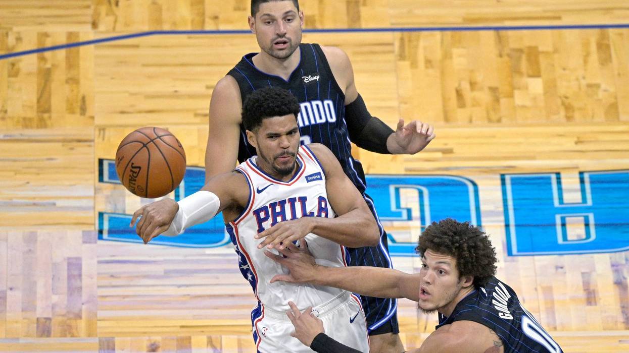Philadelphia 76ers forward Tobias Harris, front left, passes the ball.