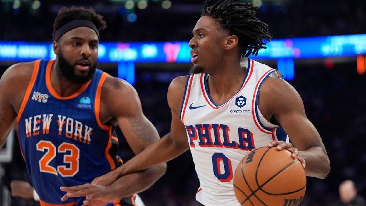 Philadelphia 76ers' Tyrese Maxey looks to pass as New York Knicks' Mitchell Robinson defends during the first half of Game 5 in an NBA basketball first-round playoff series on Tuesday.