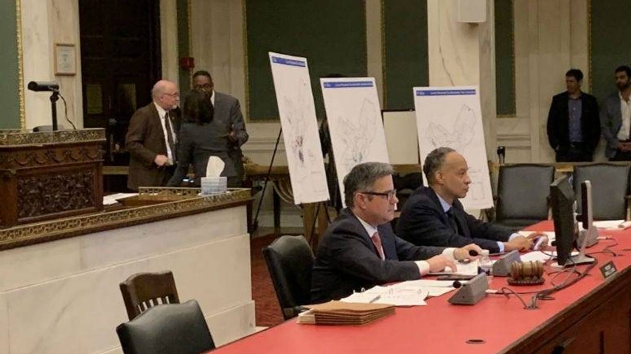 Philadelphia Councilmembers huddle during the 3.5 hour public hearing.