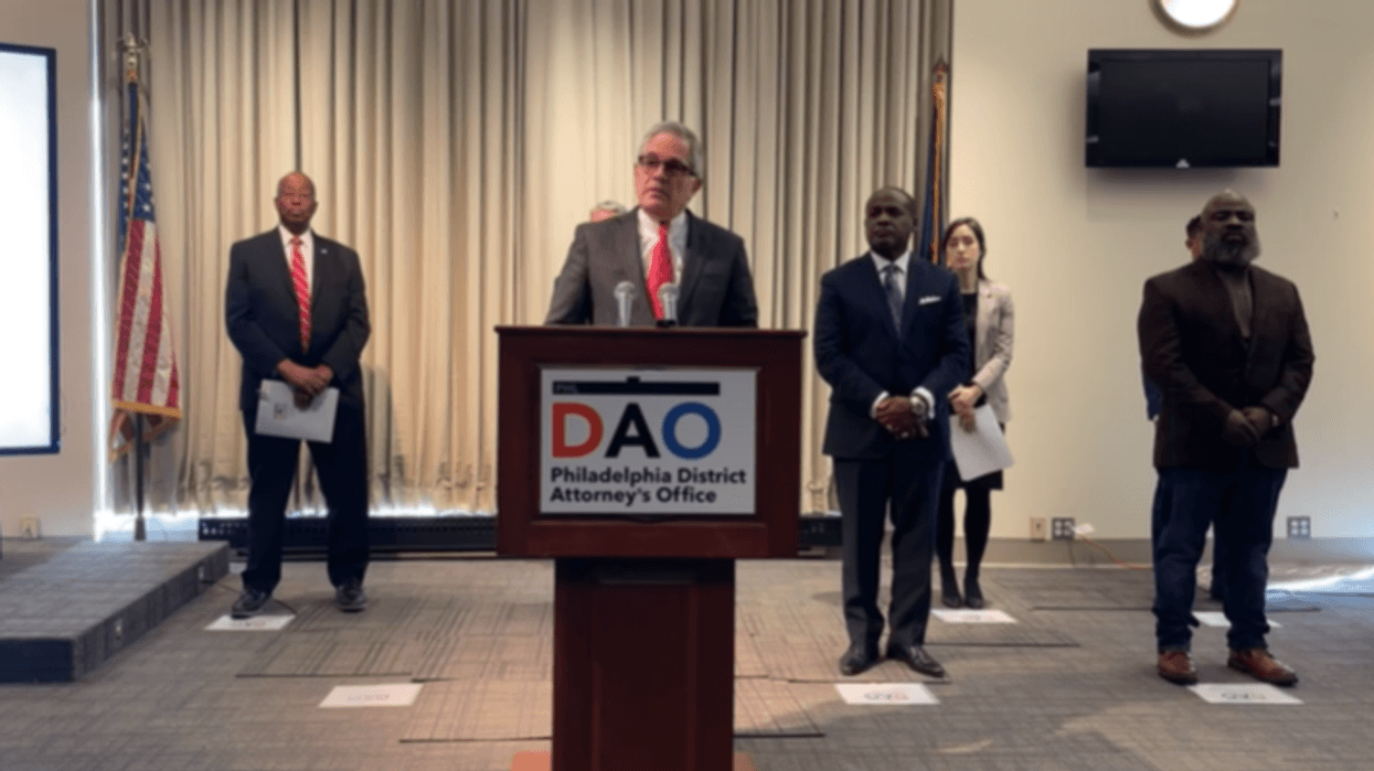 Philadelphia District Attorney Larry Krasner (center) addresses reporters on Tuesday, Jan. 7 on his office's juvenile justice initiatives.