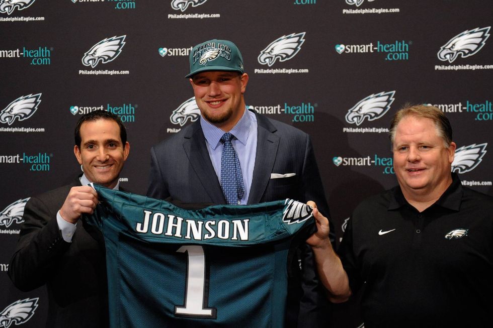 Philadelphia Eagles general manager Howie Roseman; offensive tackle Lane Johnson, the fourth overall pick of the 2013 NFL Draft; and head coach Chip Kelly pose for a photo during a press conference at the NovaCare Complex in Philadelphia on April 26, 2013.