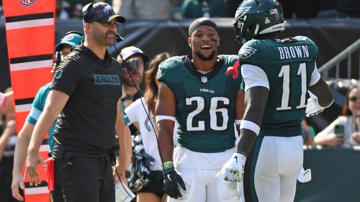 Philadelphia Eagles head coach Nick Sirianni and running back Saquon Barkley celebrate a touchdown catch by wide receiver A.J. Brown against the Cleveland Browns on Sunday.