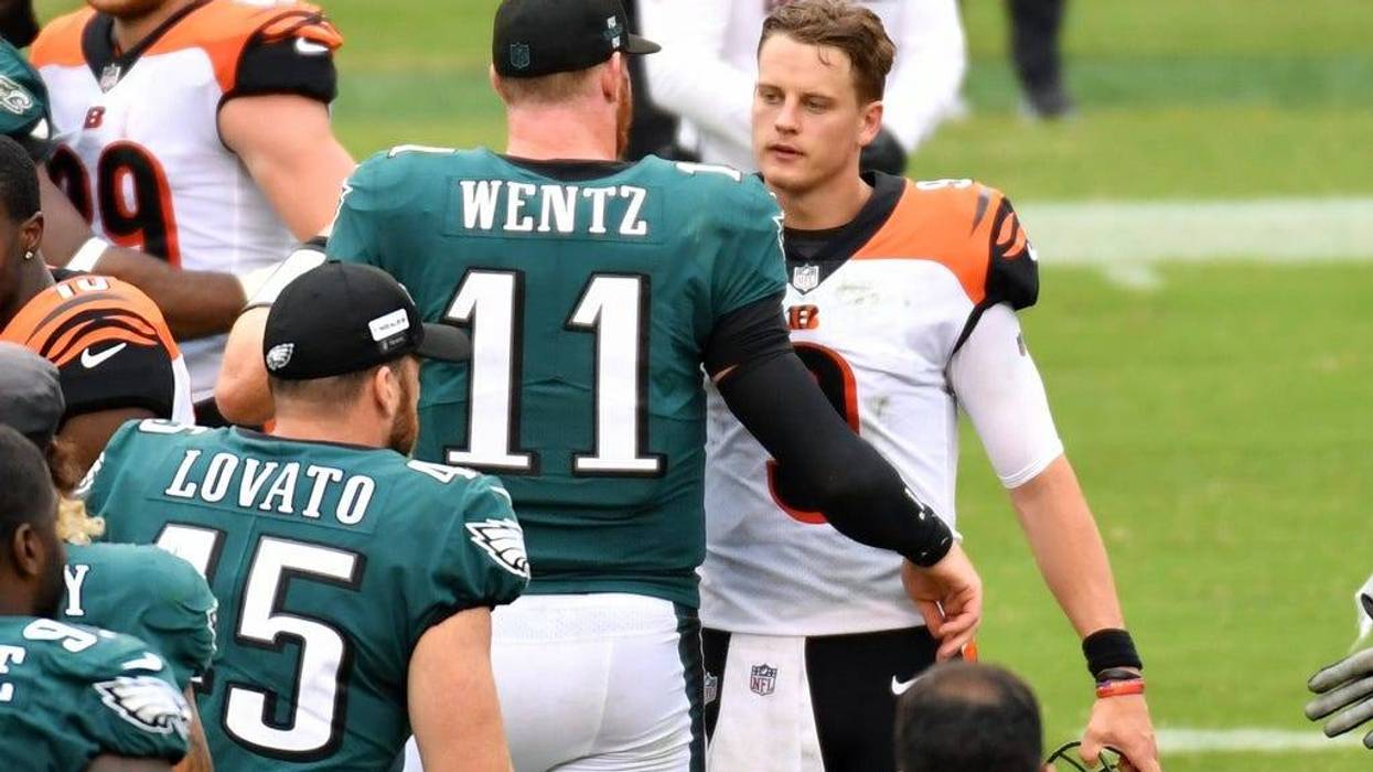 Philadelphia Eagles quarterback Carson Wentz (11) and Cincinnati Bengals quarterback Joe Burrow (9) meet on the field after the game at Lincoln Financial Field.