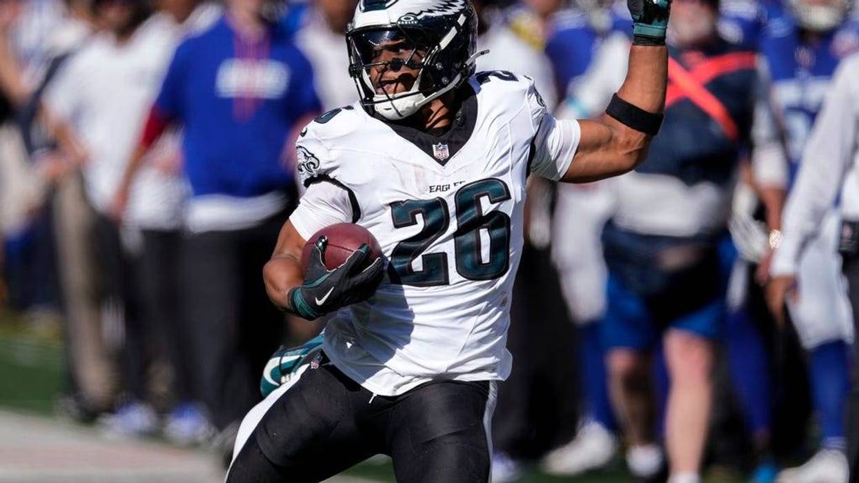 Philadelphia Eagles running back Saquon Barkley carries the ball for a first down against the New York Giants during the second quarter of an NFL football game, Sunday, Oct. 20, 2024, in East Rutherford, N.J.