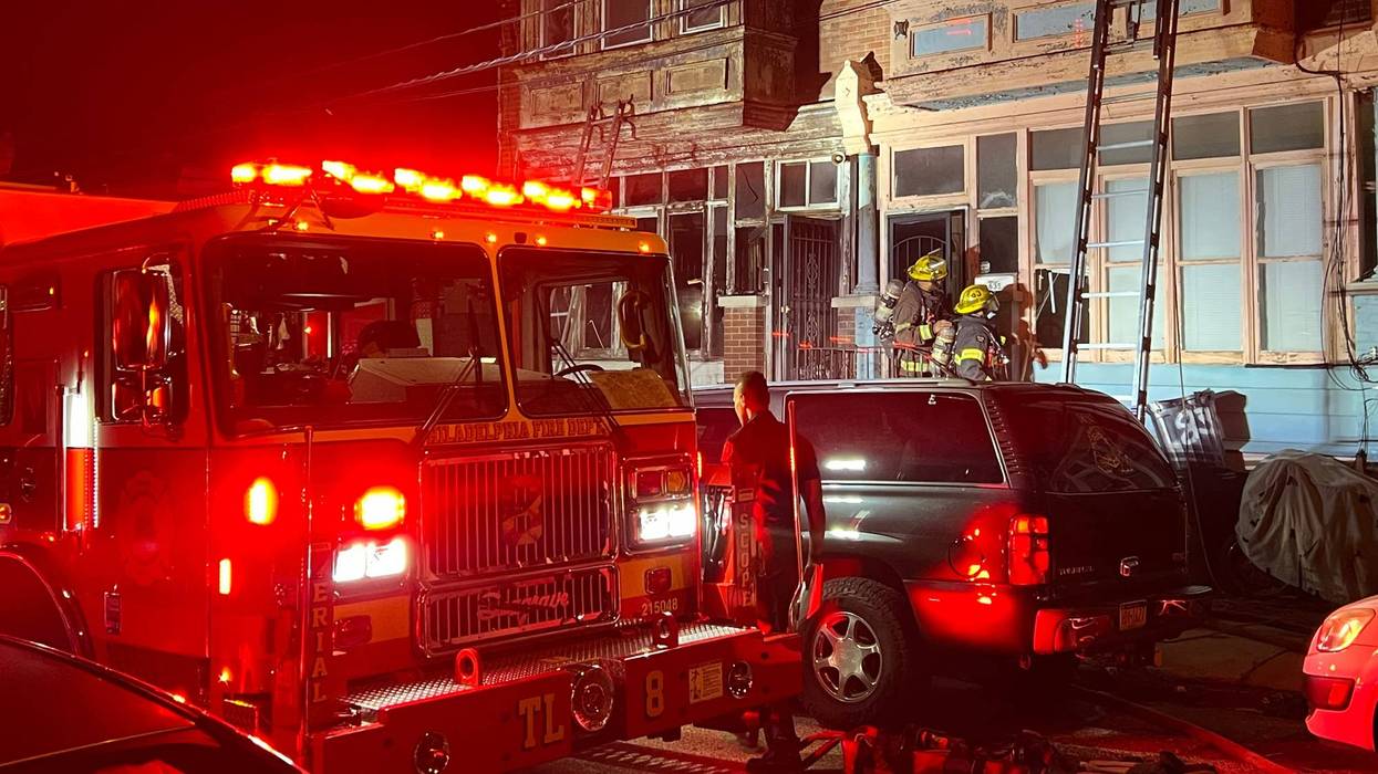 Philadelphia firefighters responding to a fire in E. Germantown.