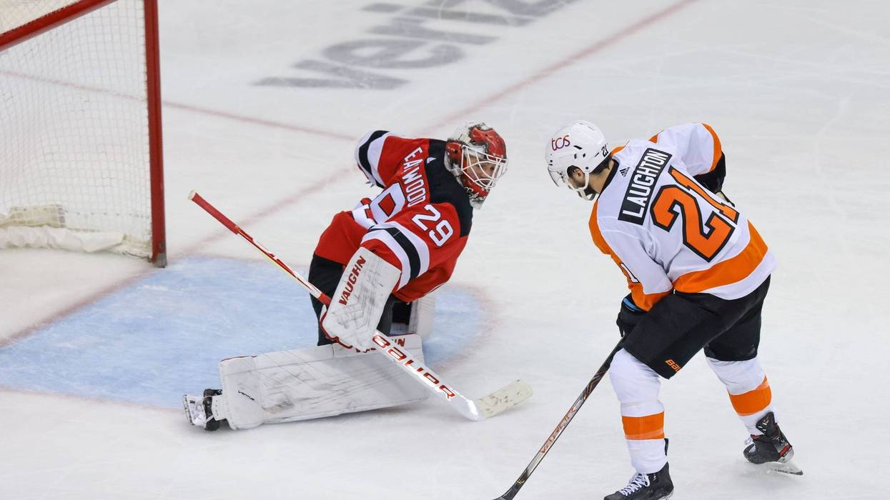 Philadelphia Flyers left wing Scott Laughton (21) scores a goal past New Jersey Devils goaltender Mackenzie Blackwood (29) during the second period at Prudential Center.