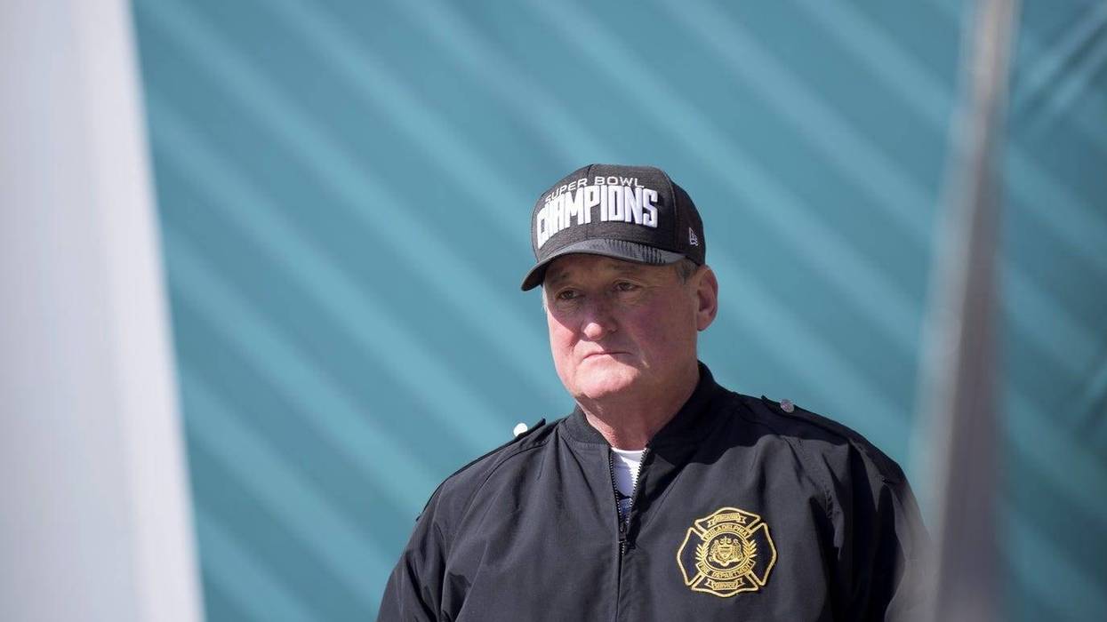 Philadelphia mayor Jim Kenney stands atop the Museum of Art staircase as a Super Bowl parade is held for the Eagles.