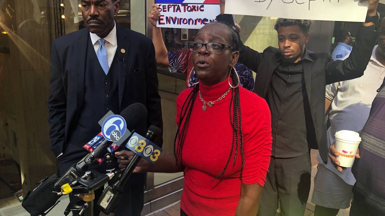 Philadelphia NAACP President Rodney Muhammad and former SEPTA employee Tera Bryant address reporters outside SEPTA headquarters.