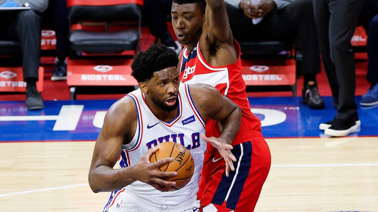 PHILADELPHIA, PENNSYLVANIA - JANUARY 06: Joel Embiid #21 of the Philadelphia 76ers drives past Thomas Bryant #13 of the Washington Wizards during the third quarter at Wells Fargo Center on January 06, 2021 in Philadelphia, Pennsylvania.