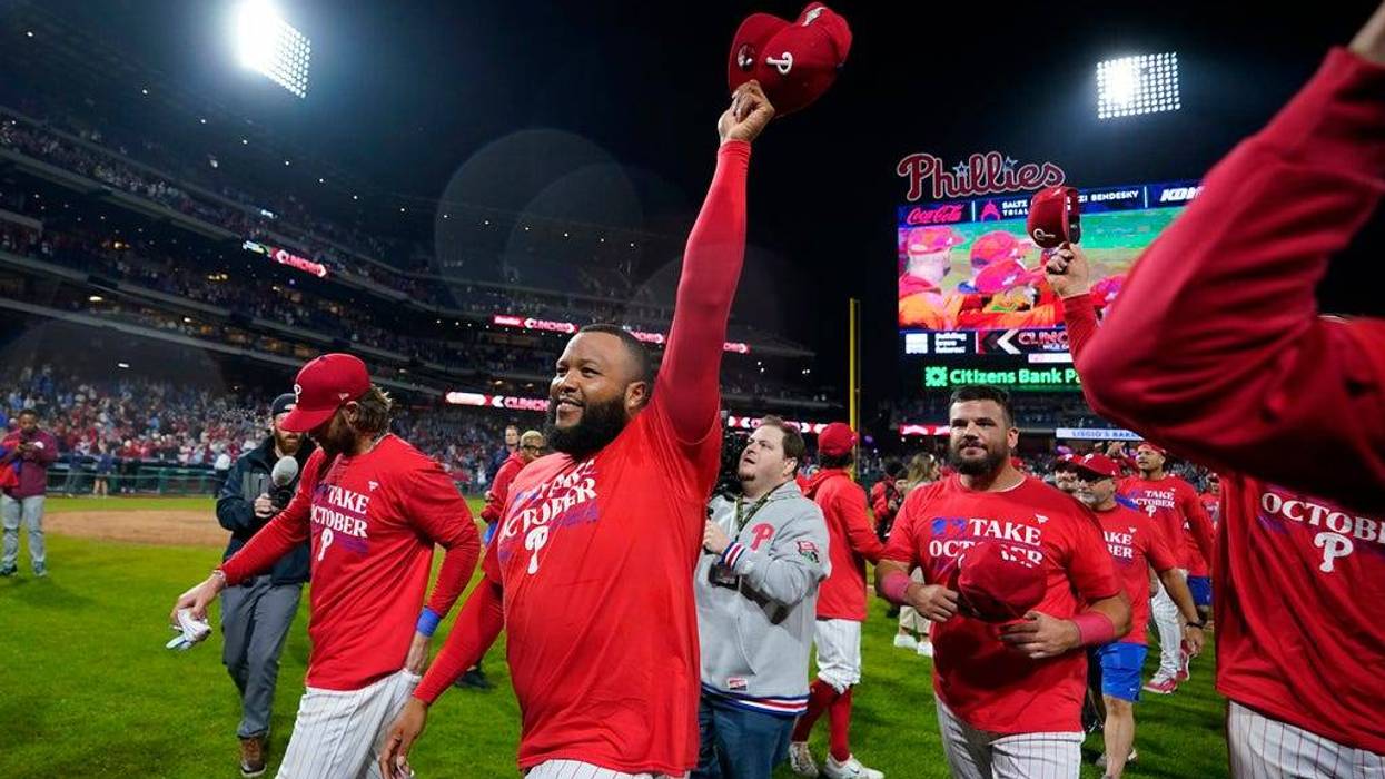 Philadelphia Phillies' Jose Alvarado celebrates after winning a baseball game against the Pittsburgh Pirates to clinch a wild-card playoff spot, Tuesday, Sept. 26, 2023, in Philadelphia. (AP Photo/Matt Slocum)