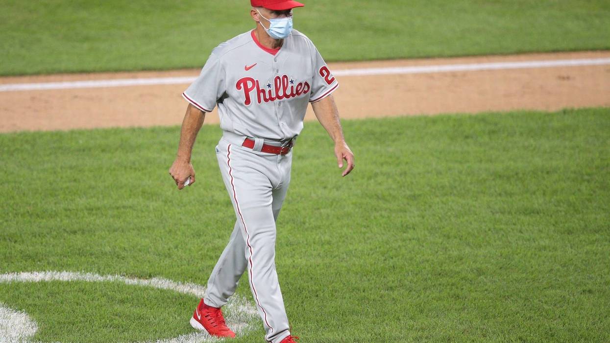 Philadelphia Phillies manager Joe Girardi walks off the field after making a pitching change during the sixth inning against the New York Yankees at Yankee Stadium.