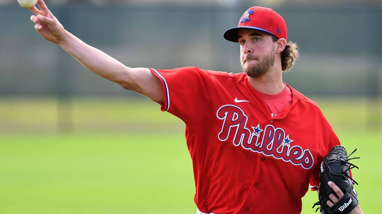 Philadelphia Phillies pitcher Aaron Nola (27) throws during Wednesday's spring training workout at Spectrum Field.