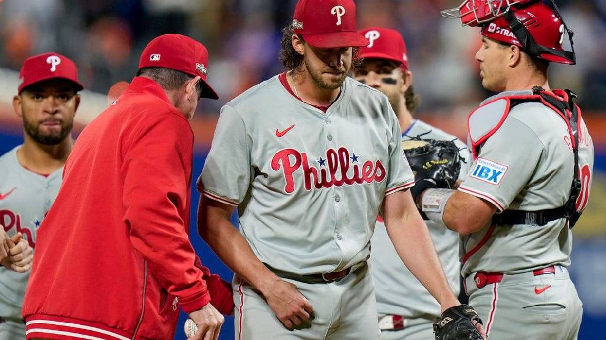 Philadelphia Phillies pitcher Aaron Nola is relieved by manager Rob Thomson during the sixth inning of Game 3 of the National League baseball playoff series against the New York Mets, Tuesday, Oct. 8, 2024, in New York.