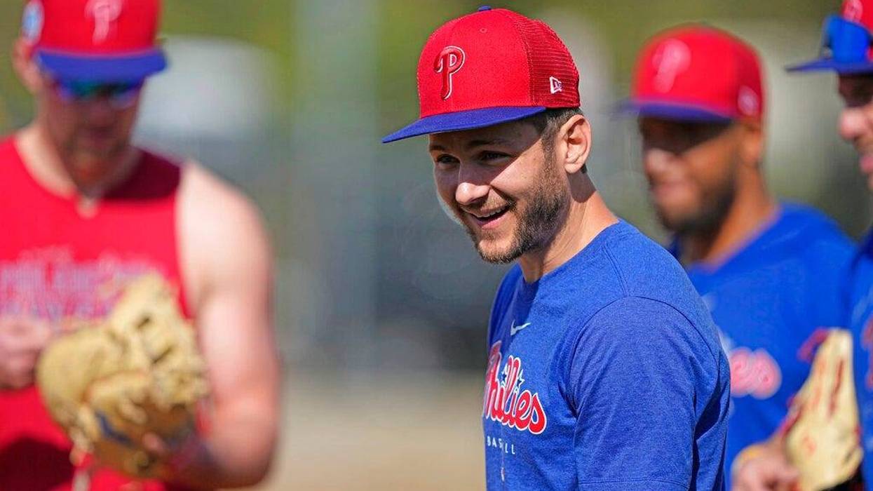 Philadelphia Phillies shortstop Trea Turner smiles during a spring training baseball workout Friday, Feb. 17, 2023, in Clearwater, Fla.