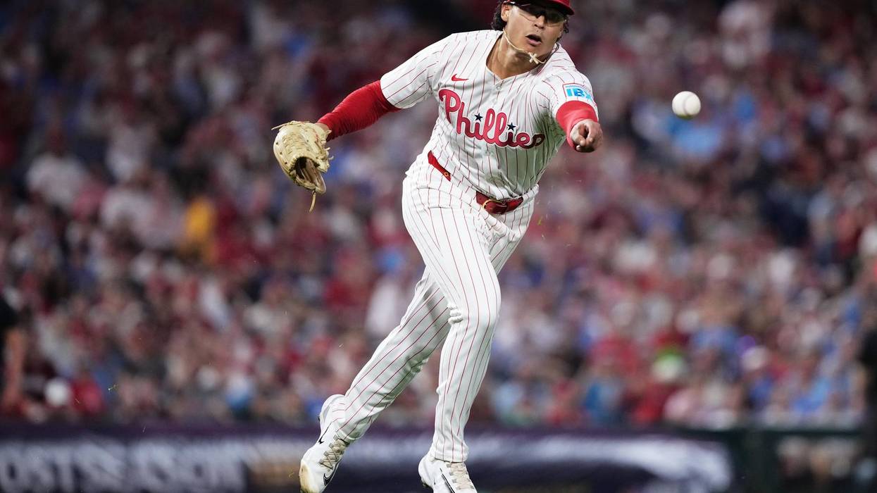 Philadelphia Phillies starting pitcher Jesús Luzardo throws out Los Angeles Dodgers' Teoscar Hernandez at first during the fourth inning in Game 2 of baseball's National League Division Series, Oct. 6, 2025, in Philadelphia.