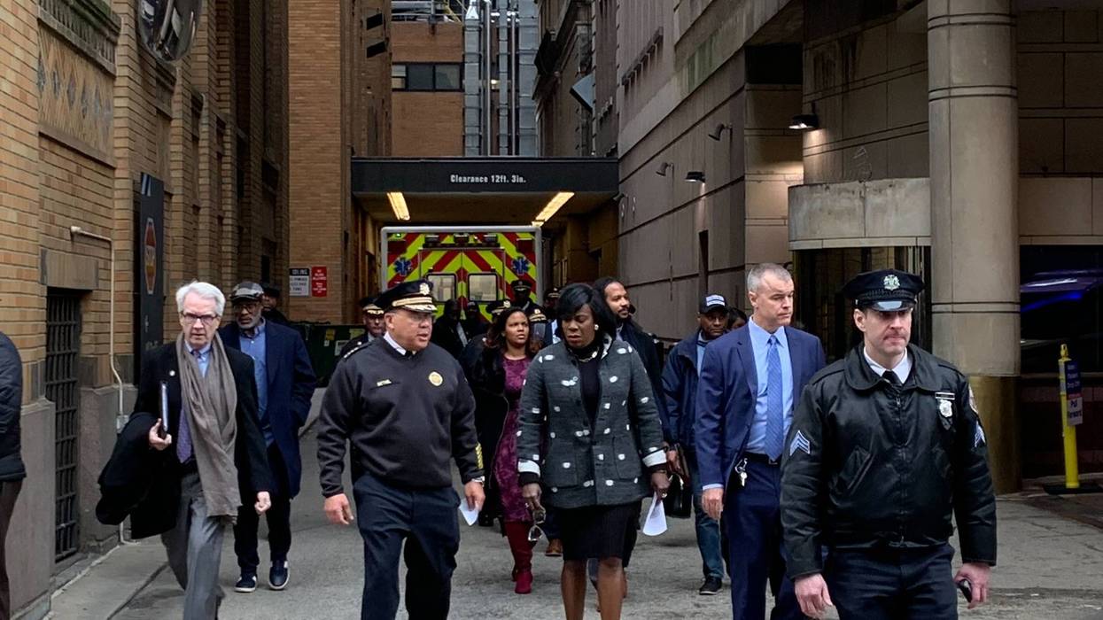 Philadelphia Police Commissioner Kevin Bethel (second from left) and Mayor Cherelle Parker (third from left) walk out of Jefferson Hospital to address the media after a police officer was shot in the hand while serving a warrant, Jan. 31, 2024.