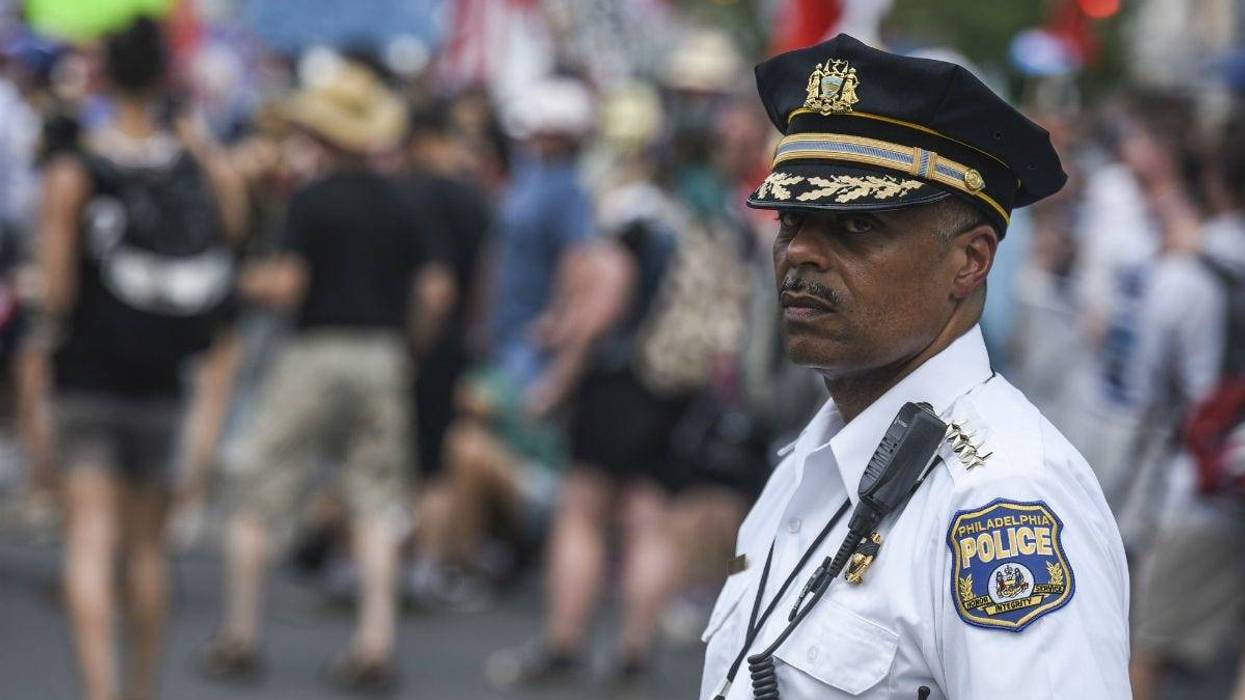 Philadelphia police commissioner Richard Ross Jr. kept an eye as Bernie Sanders supporters march down Broad Street during the Democratic National Convention.