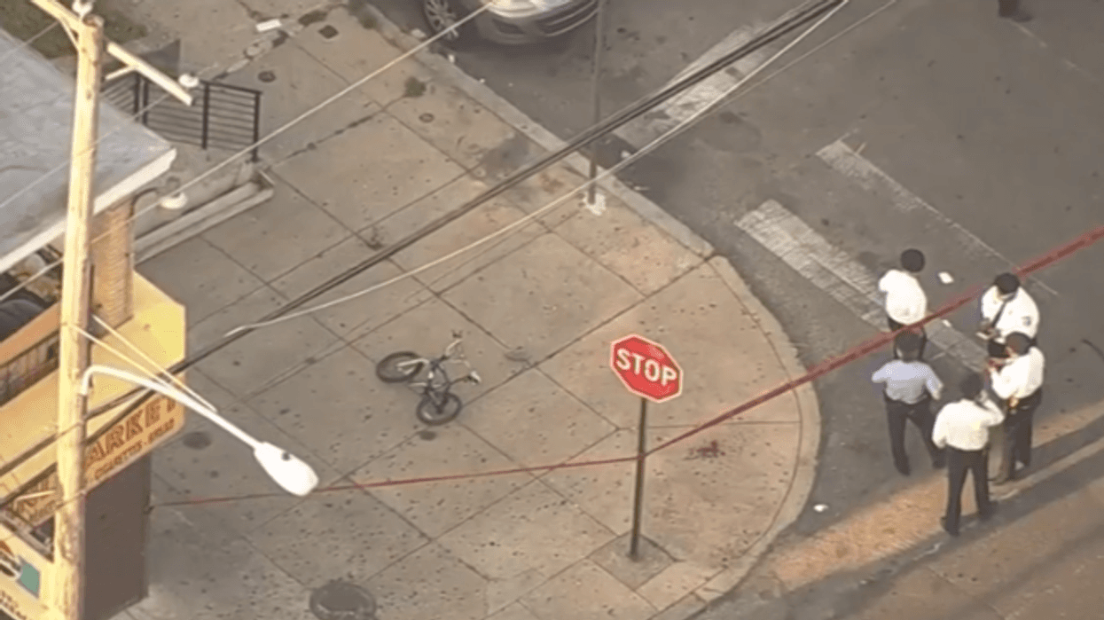 Philadelphia police investigate the scene where four boys were shot, one fatally, in the Ogontz section of the city.