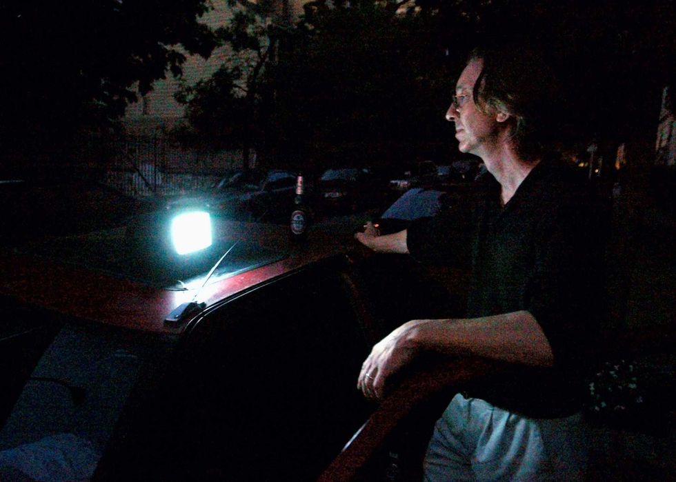 Philip Wilentz of Brooklyn Heights watches television powered by his car cigarette lighter.