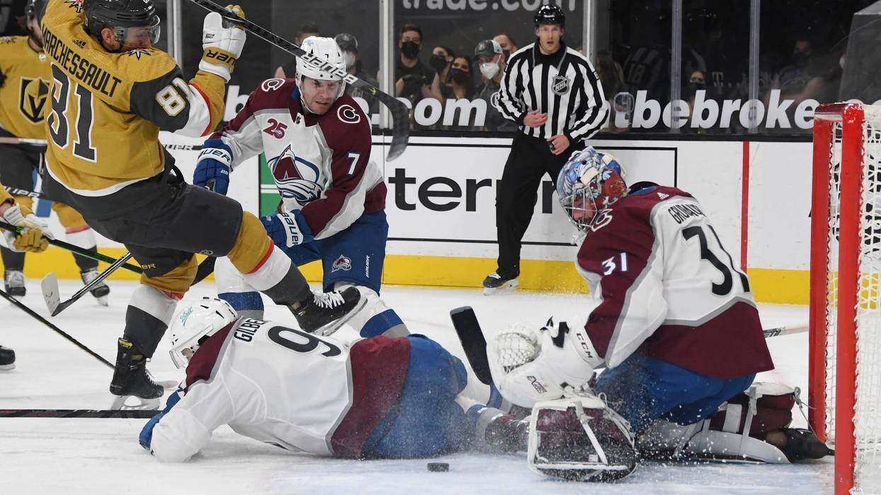 Philipp Grubauer #31 of the Colorado Avalanche makes a save against Jonathan Marchessault #81 of the Vegas Golden Knights as Dennis Gilbert #9 of the Avalanche defends in the second period of their game at T-Mobile Arena on February 14, 2021 in Las Vegas, Nevada.