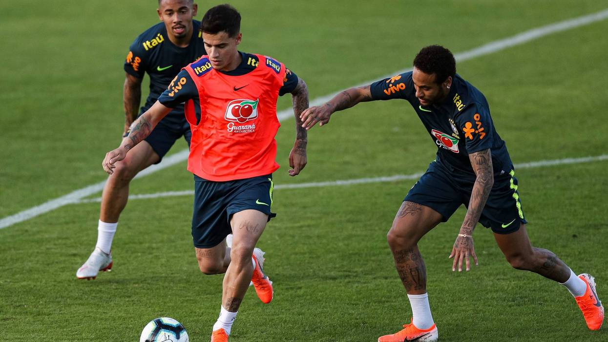Philippe Coutinho (C) and Neymar Jr (R) compete for the ball during a training session of the Brazilian national football team at the squad's Granja Comary training complex on May 28, 2019 in Teresopolis, Brazil.