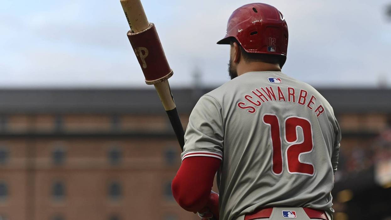 Phillies designated hitter Kyle Schwarber stands on the field before a first inning at-bat against the Baltimore Orioles at Oriole Park at Camden Yards.