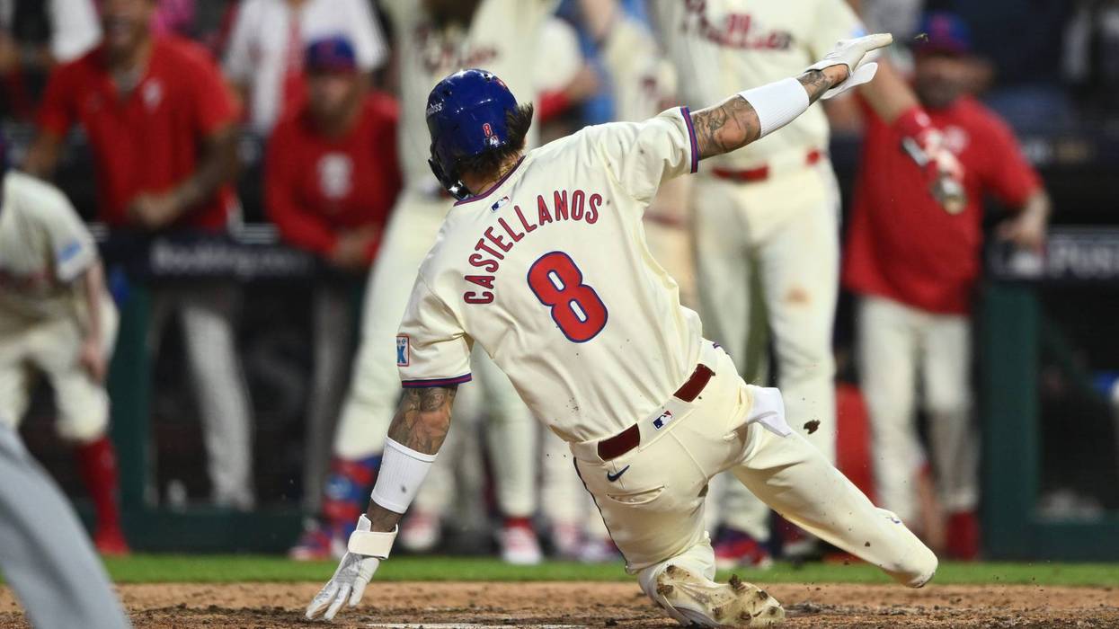Phillies outfielder Nick Castellanos scores a run in the eighth inning against the New York Mets during Game Two of the NLDS for the 2024 MLB Playoffs at Citizens Bank Park.