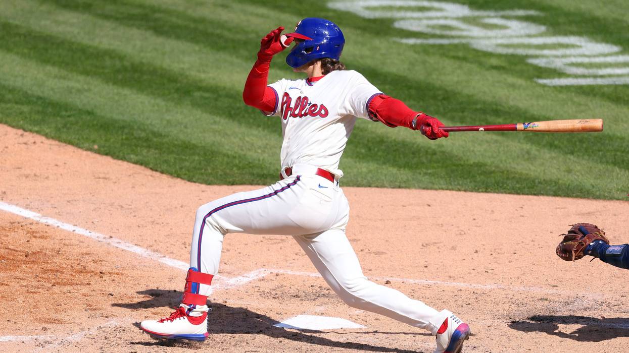 Phillies third baseman Alec Bohm hits a single to score the go ahead run against the Atlanta Braves in the eighth inning of a baseball game at Citizens Bank Park on April 4, 2021. The Phillies defeated the Braves 2-1.
