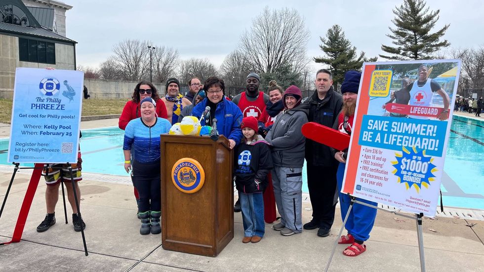 Philly Parks and Recreation Commissioner Kathryn Ott Lovell (center) and Deputy Commissioner Bill Salvatore (second from right) welcomed swimmers to the Philly Phreeze Pool Plunge.